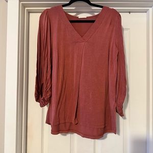 95Rayon and 5 Spandex v neck 3/4 length sleeve. The sleeve has elastic band @60